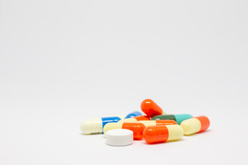 Group of capsuals and drugs on white background.