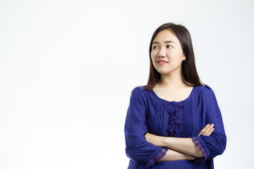 Fototapeta premium Portrait photograph of smart and good looking Asian women in the blue shirt close up on white background. Studio lighting set up.