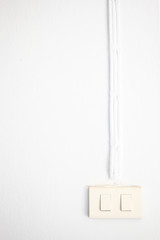 Basic electric power switches installed in wall close up.