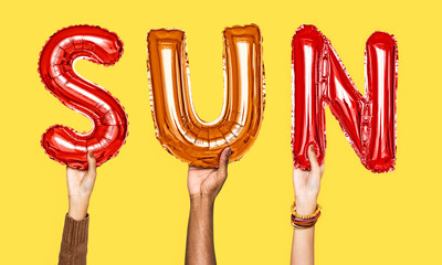 Hands showing sun balloons word