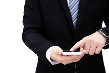 Portrait of business man in formal black suit tapping on a smartphones close up.  Isolated on white background.
