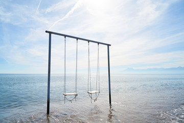 a swing in the middle of the sea