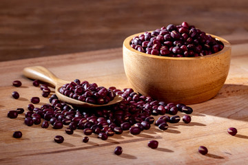 azuki beans in wood bowl on table