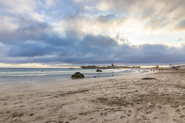 Totoralillo beach at Coquimbo region in north Chile at Atacama Desert is an amazing wild beach with a nice peninsula with cottages and awe cloudy colorful sunsets. Atacama Desert, Chile