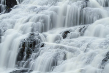 Fototapeta na wymiar Close up of flowing waterfall