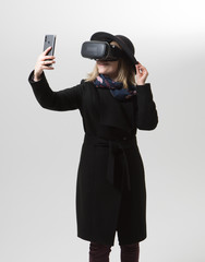 Fototapeta na wymiar Woman uses a virtual reality glasses. VR 360. Virtual game.