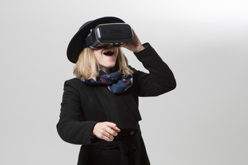 Woman uses a virtual reality glasses.  VR 360. Virtual game.