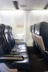Empty row of seats on an airplane