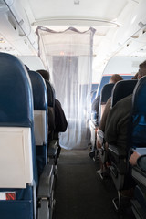 The curtain dividing first class from coach on a small plane