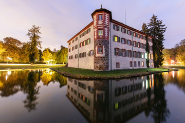 Water castle Eichtersheim, Angelbachtal Germany, with beautiful reflections at dawn