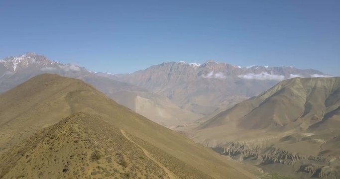 High angle aerial drone 360 panoramic view RL pan of snow covered world 7th tallest Dhaulagiri mountain, Lupra valley and Himalayan range landscape in Muktinath, Nepal. Part 1 of 2. 4k 1.9:1 23.976fps