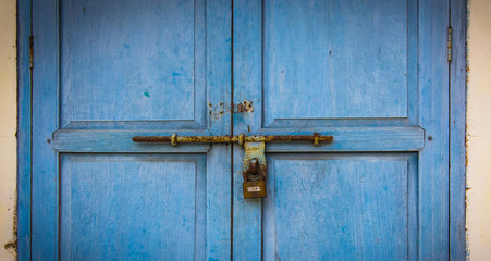 old wooden door with rusty lock from antique building,vintage