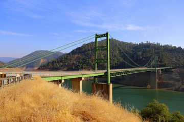 susupension bridge crossing a lake