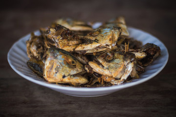 Fried fish heads for a simple meal of rural people in Thailand