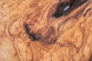 Natural Italian olive wood cutting board like abstract art texture, backboard