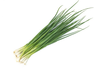 Green onion or garlic chives, chinese chive isolated on white background.Fresh healthy organic green vegetable - obrazy, fototapety, plakaty