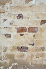 Empty Old Painted Brick Stucco Wall Texture With Damaged Plaster as Copy Space