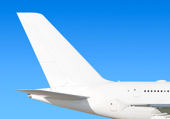 Largest heavy modern wide body passenger jet engine airplane flying side panoramic detailed tail fin exterior view reference isolated on blue sky background air travel transportation white theme
