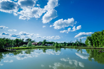 Obraz na płótnie Canvas summer landscape with lake and blue sky