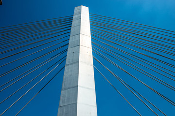 Obraz na płótnie Canvas Cable-stayed bridge piers and cable-stayed cables under the blue sky