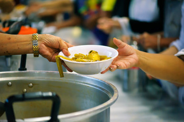 The hands of the rich give food to the hands of the poor. Concept: The concept of sharing