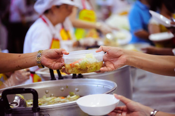 The hands of the rich give food to the hands of the poor. Concept: The concept of sharing