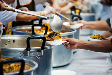 The hands of the rich give food to the hands of the poor. Concept: The concept of sharing