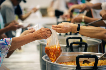 The hands of the rich give food to the hands of the poor. Concept: The concept of sharing