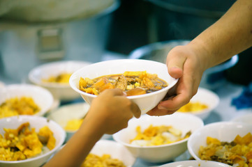 The hands of the rich give food to the hands of the poor. Concept: The concept of sharing