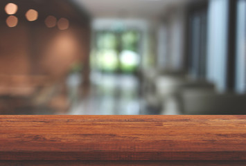 Empty wooden table top on blurred background of resturant, Used for display or montage your products