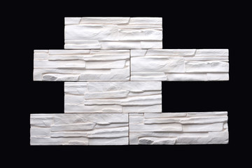 Gypsum decorative white bricks for finishing the walls after repair. Minimalist style. Work of the designer