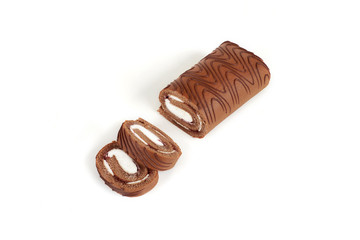 Chocolate biscuit roll cake isolated on white background.