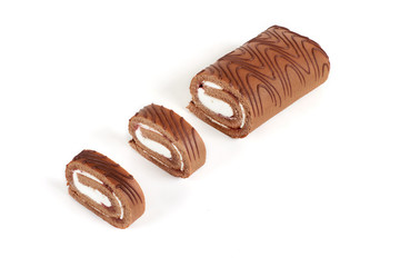 Chocolate biscuit roll cake isolated on white background.
