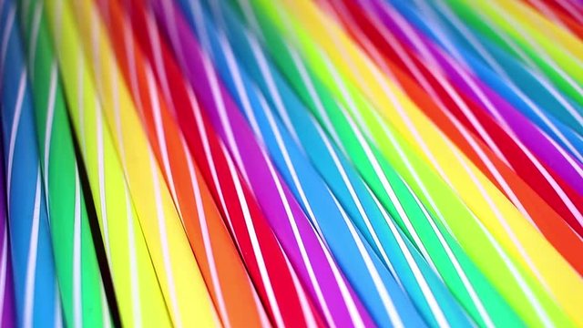 Fancy straw straws colorful rainbow colored rotating seamless looping background