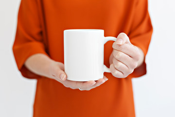 women holding coffee mug