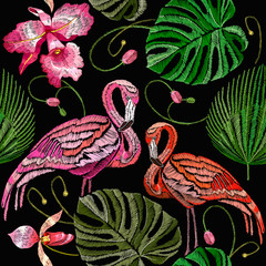 Naklejka premium Embroidery flamingo, palm tree leaves, tropical seamless pattern. Fashionable template for design of clothes. Tropical embroidery pink flamingos, summer background