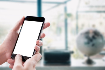 Mockup smartphone blank screen in woman hands over blurred background.