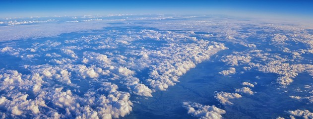 Aerial Cloudscape view over midwest states on flight over Colorado, Kansas, Missouri, Illinois, Indiana, Ohio and West Virginia during autumn. Grand sweeping views of landscape and clouds. Views of cr