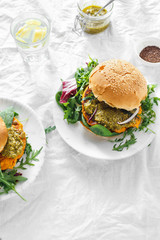 Vegetarian burger pumpkin cutlet spinach arugula pesto top view Healthy food