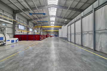 Spacious factory shop. Interior of the industrial workshop