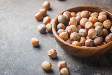 Natural hazelnut in a wooden bowl