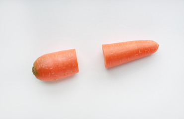 Cut half carrot on white background.