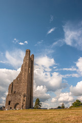 The Yellow Tower of the Abbey of St. Mary with blue sky and clouds background, Trim, county Meath, Ireland