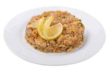 rice with chicken and vegetables on a plate, on top of a slice of lemon. on white background, isolate