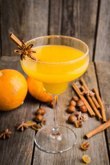 Tasty pumpkin margarita cocktail on the rustic background. Selective focus. Shallow depth of field.