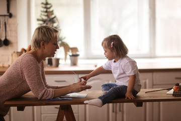 Mom teaches with Toddler with Down syndrome