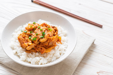 stir-fried pork with kimchi on topped rice