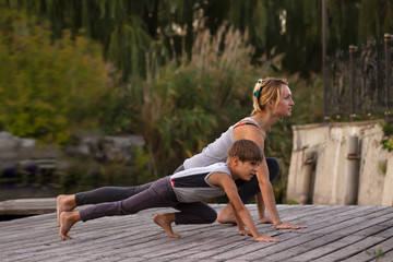 Mother and son exercising  yoga  pose