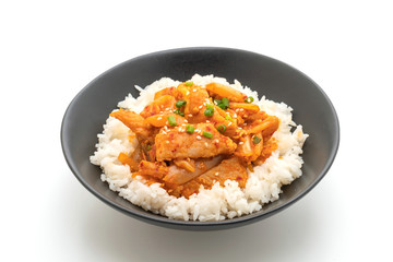 stir-fried pork with kimchi on topped rice isolated on white background