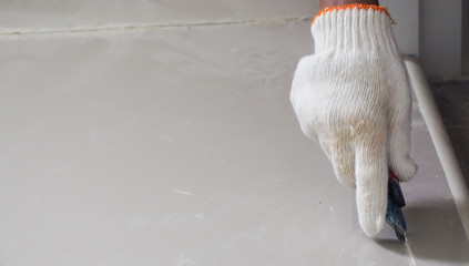 The focus at hand worker repair tile